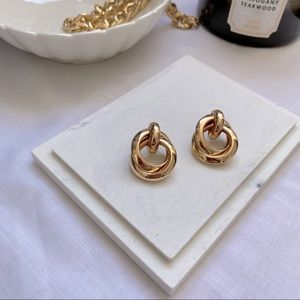 Brand new gold metal stud earrings